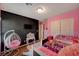 Bedroom featuring a loft bed, hanging chair, closet, and chalkboard wall with a television at 4535 Mission Meadow Cir, Las Vegas, NV 89139