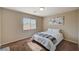 Inviting bedroom features soft natural light and a cozy bed with a patterned throw at 4535 Mission Meadow Cir, Las Vegas, NV 89139