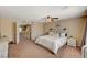 This main bedroom offers carpet, ceiling fan, and a simple decor style at 4535 Mission Meadow Cir, Las Vegas, NV 89139
