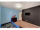 Bedroom with a blue race car bed, TV, chalkboard wall, carpeted floor, and a closet at 4535 Mission Meadow Cir, Las Vegas, NV 89139