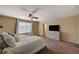 Carpeted bedroom featuring a ceiling fan, window and basic decor at 4535 Mission Meadow Cir, Las Vegas, NV 89139