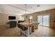 Open-concept kitchen with large island, barstools, and seamless flow to living areas at 4535 Mission Meadow Cir, Las Vegas, NV 89139
