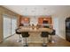 Modern kitchen with granite countertops, stainless steel appliances, and barstool seating at 4535 Mission Meadow Cir, Las Vegas, NV 89139