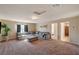 Spacious living room with a comfortable gray sofa and neutral-toned walls at 4535 Mission Meadow Cir, Las Vegas, NV 89139