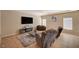 Comfortable living room featuring neutral tones, a TV, and cozy seating area at 4535 Mission Meadow Cir, Las Vegas, NV 89139