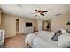 Spacious main bedroom featuring a ceiling fan, television, carpeted floors, and a king bed at 4535 Mission Meadow Cir, Las Vegas, NV 89139