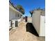 Backyard with a shed, and gate with partial walls on a sunny day at 4560 Rancho Hills Dr, Las Vegas, NV 89119