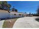 Ranch style home featuring a long, covered porch and concrete driveway at 4560 Rancho Hills Dr, Las Vegas, NV 89119