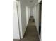 Bright hallway featuring neutral paint, wood-look floors and storage at 4560 Rancho Hills Dr, Las Vegas, NV 89119