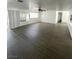 Spacious living room with laminate flooring and access to kitchen and backyard at 4560 Rancho Hills Dr, Las Vegas, NV 89119