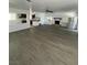 Bright living room featuring sleek floors, fireplace, and modern ceiling fan at 4560 Rancho Hills Dr, Las Vegas, NV 89119