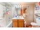 A functional bathroom featuring a single sink vanity and a shower-tub combination at 4648 Krissylouise Way, Las Vegas, NV 89121