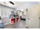 Bedroom with mirrored closet doors, a ceiling fan, and neutral decor at 4648 Krissylouise Way, Las Vegas, NV 89121