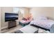 Inviting bedroom with two single beds and vinyl floors, offering a comfortable retreat at 4648 Krissylouise Way, Las Vegas, NV 89121