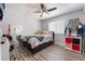 Bedroom with a full-length mirror, window, and neutral decor at 4648 Krissylouise Way, Las Vegas, NV 89121