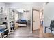 Bedroom with mirrored closet doors, a ceiling fan, and neutral decor at 4648 Krissylouise Way, Las Vegas, NV 89121