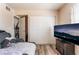 Comfortable bedroom with vinyl floors, a TV, and closet space for a private space at 4648 Krissylouise Way, Las Vegas, NV 89121
