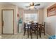 Cozy dining area with wood table, tile flooring, and natural light at 4648 Krissylouise Way, Las Vegas, NV 89121