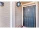 The front door with an iron security gate has external wall lights at 4648 Krissylouise Way, Las Vegas, NV 89121