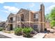 Attractive two-story condo with well-maintained landscaping, stairs leading to the entrance and ample parking space at 4648 Krissylouise Way, Las Vegas, NV 89121