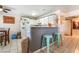 Bright kitchen with white cabinets, breakfast bar, and tile flooring at 4648 Krissylouise Way, Las Vegas, NV 89121