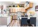 Kitchen and dining area with modern countertops and white appliances at 4648 Krissylouise Way, Las Vegas, NV 89121