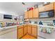 Bright kitchen featuring standard appliances and a view into the living room at 4648 Krissylouise Way, Las Vegas, NV 89121
