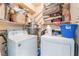 The laundry room has a washer, dryer and storage shelves at 4648 Krissylouise Way, Las Vegas, NV 89121