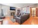 Comfortable living room with wood floors, fireplace, and an entertainment center at 4648 Krissylouise Way, Las Vegas, NV 89121