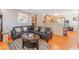 Open-concept living room with a view of the adjacent kitchen and comfortable furnishings at 4648 Krissylouise Way, Las Vegas, NV 89121