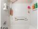 The bathroom's tub area has tiled walls and a shower head at 4648 Krissylouise Way, Las Vegas, NV 89121