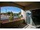 Balcony view, with a peek into the unit and a view of the street at 4655 Gold Dust Ave # 206, Las Vegas, NV 89120