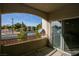 View from condo balcony overlooking the street with sliding glass door to the living area at 4655 Gold Dust Ave # 206, Las Vegas, NV 89120