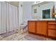 Well-maintained bathroom with oak cabinets and tile flooring at 4655 Gold Dust Ave # 206, Las Vegas, NV 89120