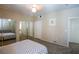 Spacious bedroom features mirrored closet doors and neutral wall color at 4655 Gold Dust Ave # 206, Las Vegas, NV 89120