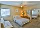 Bright bedroom featuring a bed, futon, and large mirror for an open feel at 4655 Gold Dust Ave # 206, Las Vegas, NV 89120