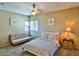 Inviting bedroom with a futon, ceiling fan, and bright natural light at 4655 Gold Dust Ave # 206, Las Vegas, NV 89120
