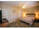 Comfortable bedroom features plush carpet, a ceiling fan and a patterned comforter at 4655 Gold Dust Ave # 206, Las Vegas, NV 89120
