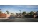 Apartment building entrance and gate, set in a well-maintained landscape at 4655 Gold Dust Ave # 206, Las Vegas, NV 89120