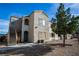 A stucco two-story condo building with stairs up to the second floor and desert landscaping at 4655 Gold Dust Ave # 206, Las Vegas, NV 89120