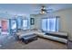Bright living room featuring a ceiling fan, carpet, and modern furniture with large windows at 4655 Gold Dust Ave # 206, Las Vegas, NV 89120