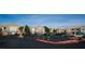 Wide view of a parking lot surrounded by two-story apartment buildings in a well-maintained complex at 4655 Gold Dust Ave # 206, Las Vegas, NV 89120