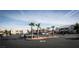 Wide view of a parking lot surrounded by two-story apartment buildings and palm trees in a well-maintained complex at 4655 Gold Dust Ave # 206, Las Vegas, NV 89120