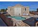 Community pool with lounge chairs, manicured landscaping and adjacent spa for relaxation at 4655 Gold Dust Ave # 206, Las Vegas, NV 89120