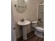 Bathroom featuring a pedestal sink, mirror, and tiled shower at 4730 E Craig Rd # 1148, Las Vegas, NV 89115
