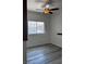 A well lit bedroom with new wood flooring, and a large window at 4730 E Craig Rd # 1148, Las Vegas, NV 89115