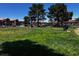 Expansive community park featuring mature trees, a playground, and well-maintained grassy areas for outdoor activities at 4730 E Craig Rd # 1148, Las Vegas, NV 89115