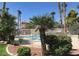 Lush landscaping surrounds the community pool, creating a private and serene oasis for residents to enjoy at 4730 E Craig Rd # 1148, Las Vegas, NV 89115