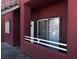 Exterior facade with sliding glass door and white railing of the apartment building at 4730 E Craig Rd # 1148, Las Vegas, NV 89115