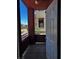 Covered patio area with mountain views framed by the open doorway at 4730 E Craig Rd # 1148, Las Vegas, NV 89115